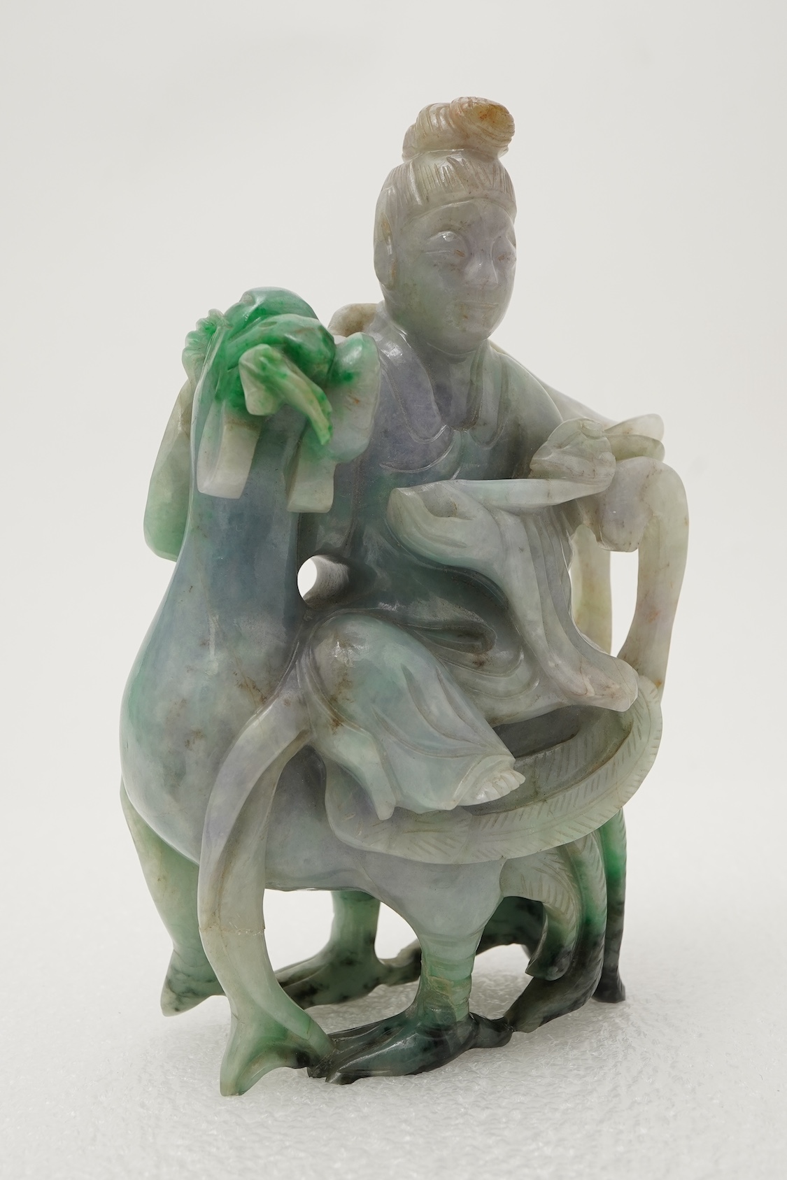 A Chinese jadeite figure of Xi Wangmu riding on a phoenix, late 19th/early 20th century